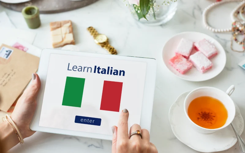 Tablet screen showing "Learn Italian" with Italian flags.